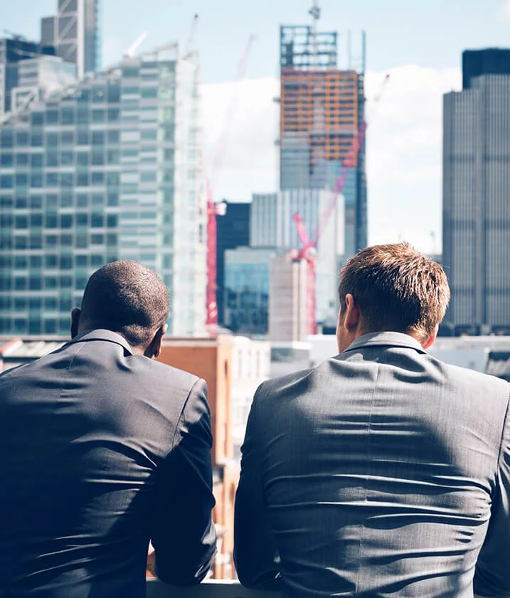 business-men-city-buildings partnering